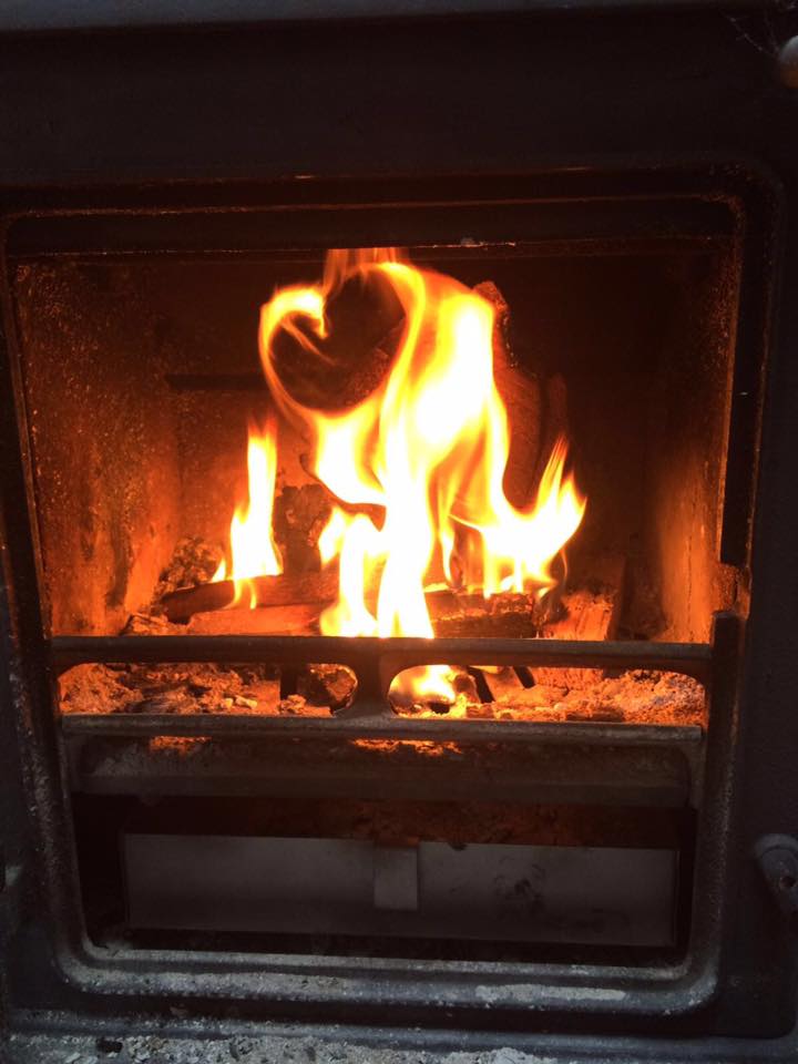 Toasting a marshmallow in a woodburner
