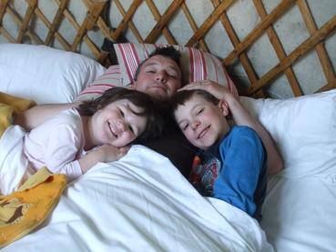 Family in yurt bed