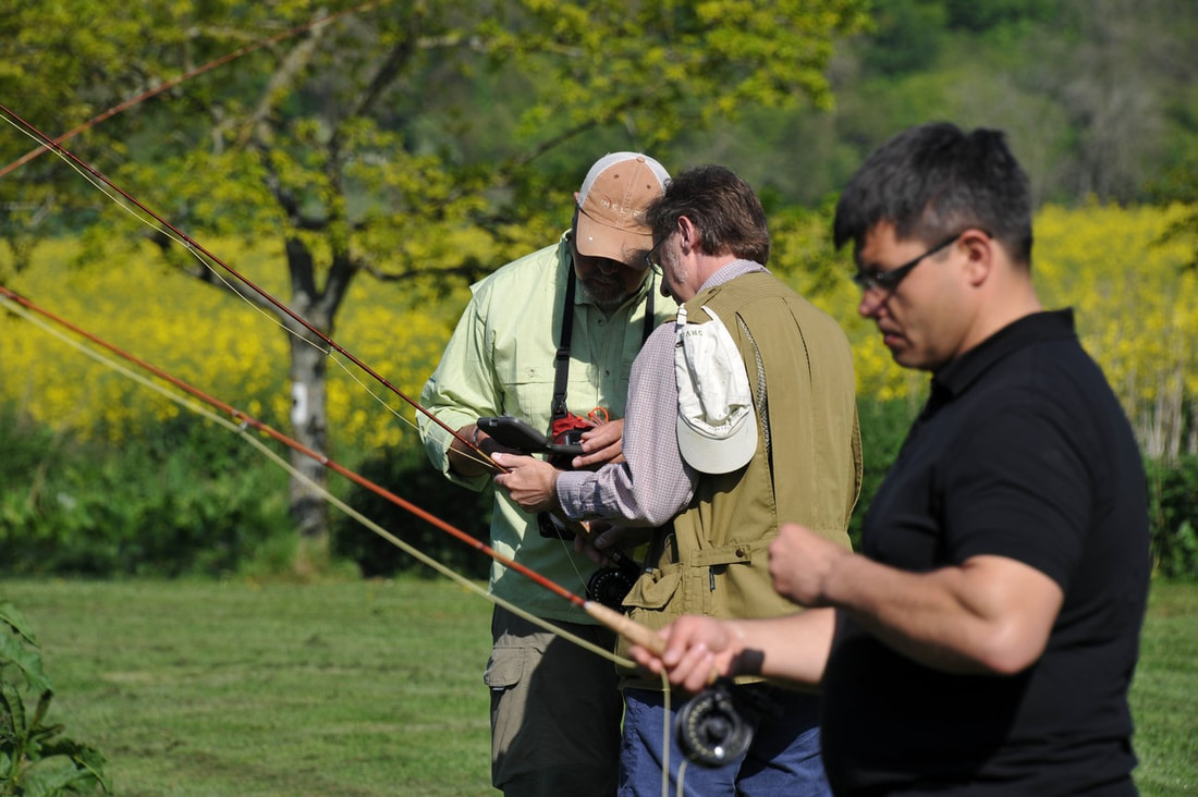 Fishing Instructor demonstrating trout fishing skills