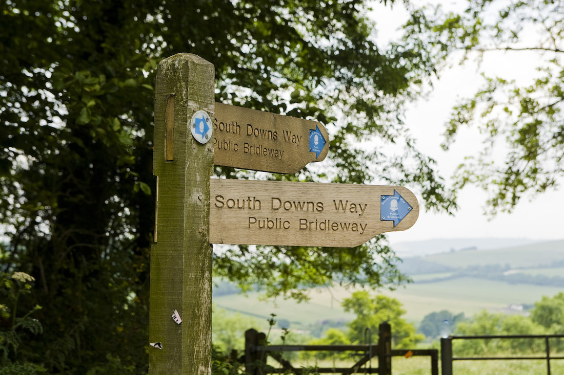 A walking sign on the South Downs way